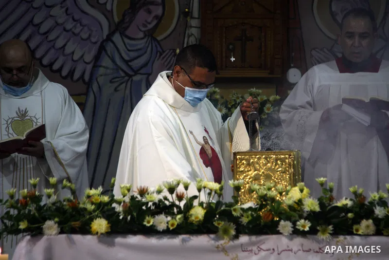 Palestinian Christians attend an Easter vigil mass, amid the coronavirus disease (COVID-19) outbreak at a church of Deir Latin, in Gaza City, on April 4, 2021. Easter Vigil, also called the Paschal Vigil or the Great Vig...