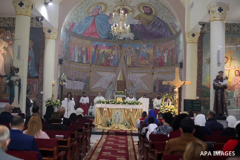 Palestinian Christians attend an Easter vigil mass, amid the coronavirus disease (COVID-19) outbreak at a church of Deir Latin, in Gaza City, on April 4, 2021. Easter Vigil, also called the Paschal Vigil or the Great Vig...