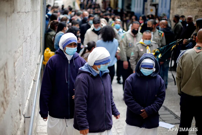Christian worshippers take part in a Good Friday procession along the Via Dolorosa amid eased coronavirus disease (COVID-19) restrictions, during Easter Holy Week in Jerusalem's Old City April 2, 2021. Good Friday is the...