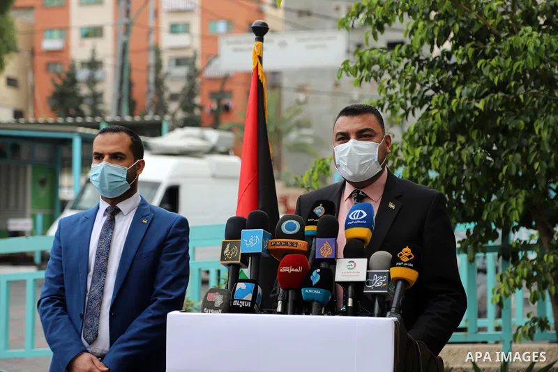 Ashraf al-Qadra, Spokesperson of the Palestinian Ministry of Health in the Gaza Strip, wearing a protective face mask, speaks during a press conference, in Gaza city on April 1, 2021. The Ministry of Interior and Nationa...