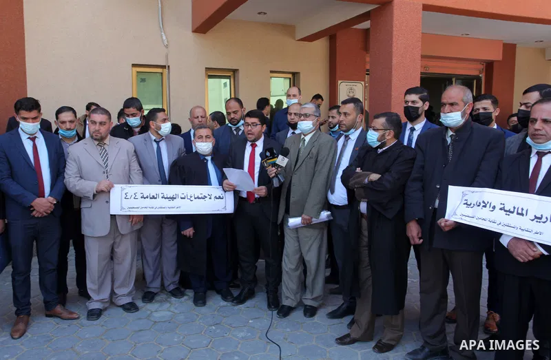 Palestinians from the Bar Association attend a press conference on the occasion of Land Day, in front of the Bar Association headquarters in Gaza City, on April 1, 2021. Palestinians every year mark Land Day on March 30...