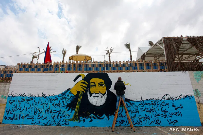 Palestinian artist Ayman Al Hosary, 32, painted a mural in an event on March 30 the Land Day's on the sea beach in Gaza City on March 30, 2021. Palestinians every year mark Land Day on March 30 commemorating the six Pale...