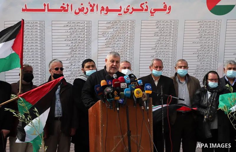 Palestinian members of the National commission for the great return march and break siege against Century Deal, attend a press confernce, near the border with Israel, east of Gaza City on March 30, 2021. Palestinians eve...