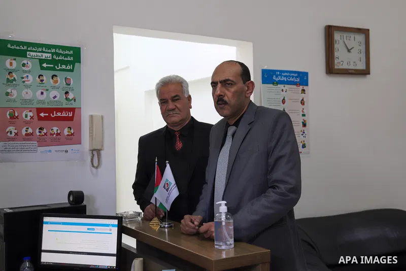 Palestinians begin registering party lists for May parliamentary election, at the Central Elections Commission's office in Gaza City, on March 29, 2021. The Fatah breakaway Dahlan movement is returning to the Gaza Strip...