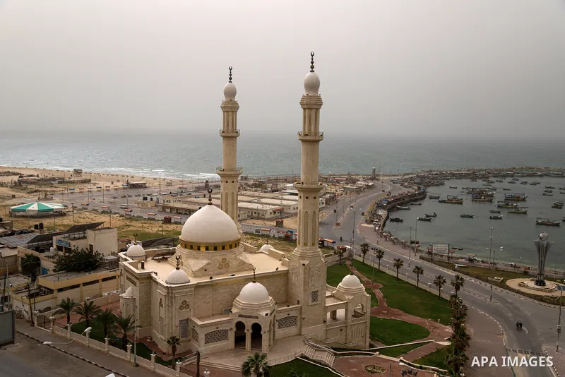 A general view shows the sea port during a sand wind (khamsin), of Gaza City on March 23, 2021. Khamsin, chamsin or more commonly known in Egypt as khamaseen is a dry, hot, sandy local wind affecting Egypt and the Levant...