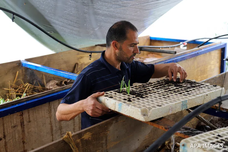 Palestinian farmer Mohsen Ahmed, 37, uses imported worms to produce organic fertilizers for plants, in Beit Lahia in the northern Gaza Strip on March 22, 2021. Organic fertilizers are beneficial for plants and vegetables...