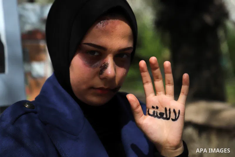Palestinian artist Zeina Al-Shurafa,19, paints on her face a "SFX Makeup" for solidarity with battered woman, in her home in Gaza City on March 10, 2021. Palestinian female victims of domestic violence have little chance...
