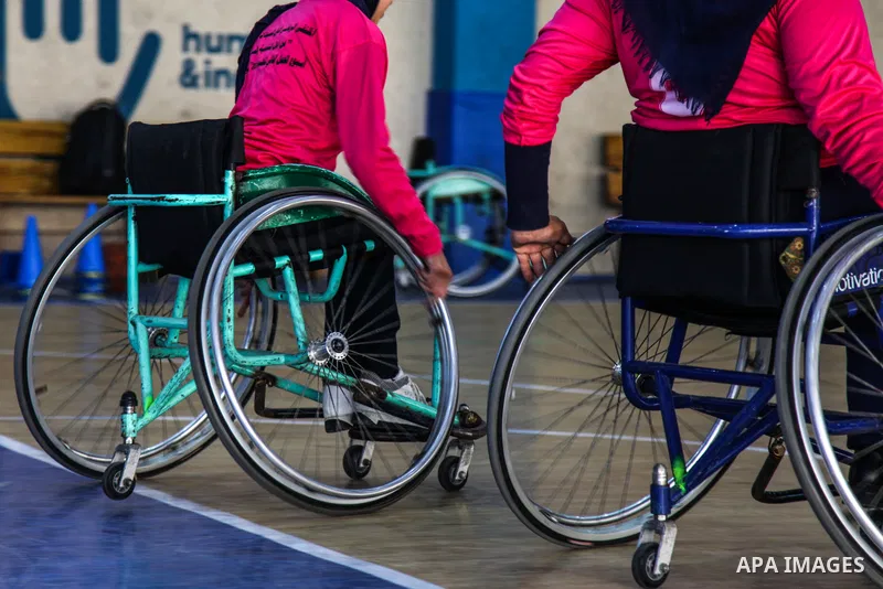 Palestinians women of special needs take part in a basketball training in a gymnasium, on the International Women's Day, on March 8, 2021. International Women's Day (IWD) is celebrated on 8 March around the world. It is...