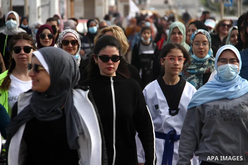 Palestinians take part in a walking sport on the International Women's Day, in Gaza city on March 8, 2021. International Women's Day (IWD) is celebrated on 8 March around the world. It is a focal point in the movement fo...