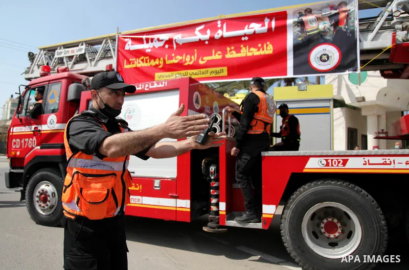 Palestinian Civil Defense members take part in a vehicle parade, to mark the International Civil Defense Day, in Gaza city, on March 1, 2021. World Civil Defence Day is celebrated on 1st March every year, its an attempt...