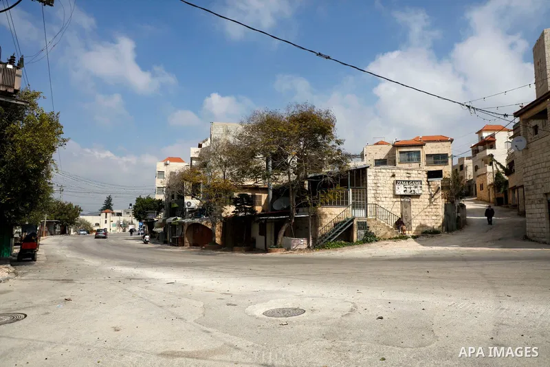 A deserted street is pictured during a complete closure, amid the coronavirus lockdown in the town of Zababdeh, south of Jenin, in the West Bank on February 28, 2021. Prime Minister Mohammad Shtayyeh announced a new set...