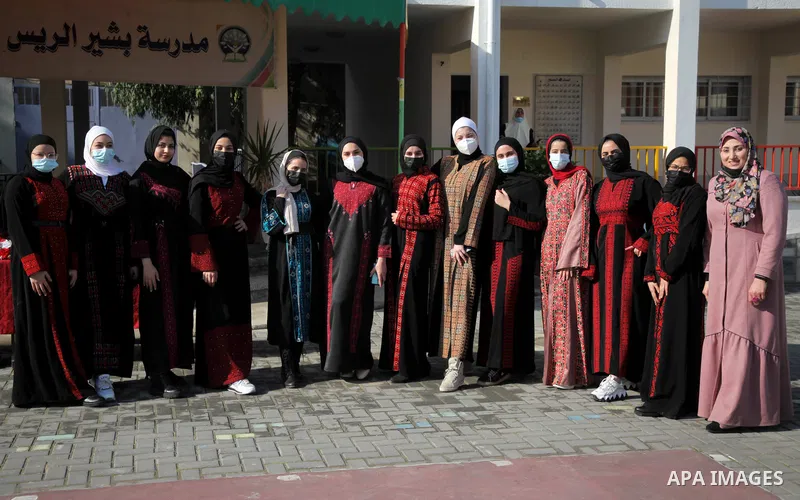 Palestinian students wearing protective face masks, return back to their school, in the morning of the first day of the second semester study, amid the coronavirus disease (COVID-19) outbreak, in Gaza city, on February 2...
