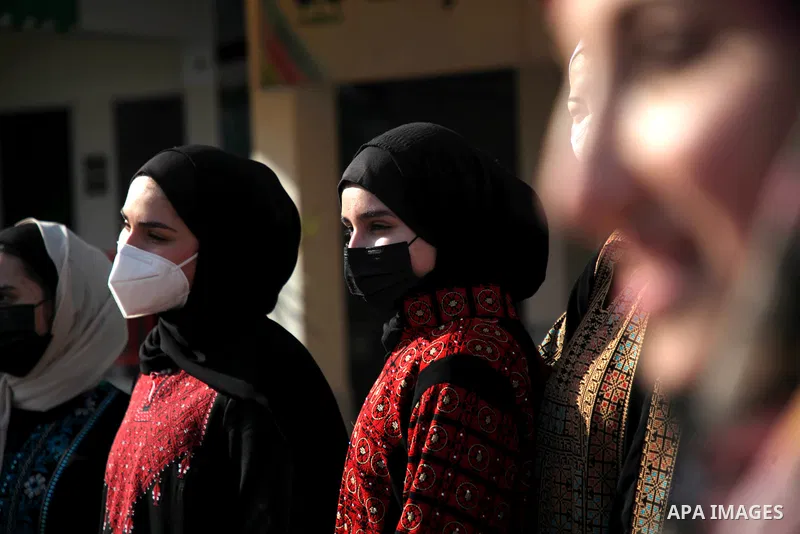 Palestinian students wearing protective face masks, return back to their school, in the morning of the first day of the second semester study, amid the coronavirus disease (COVID-19) outbreak, in Gaza city, on February 2...