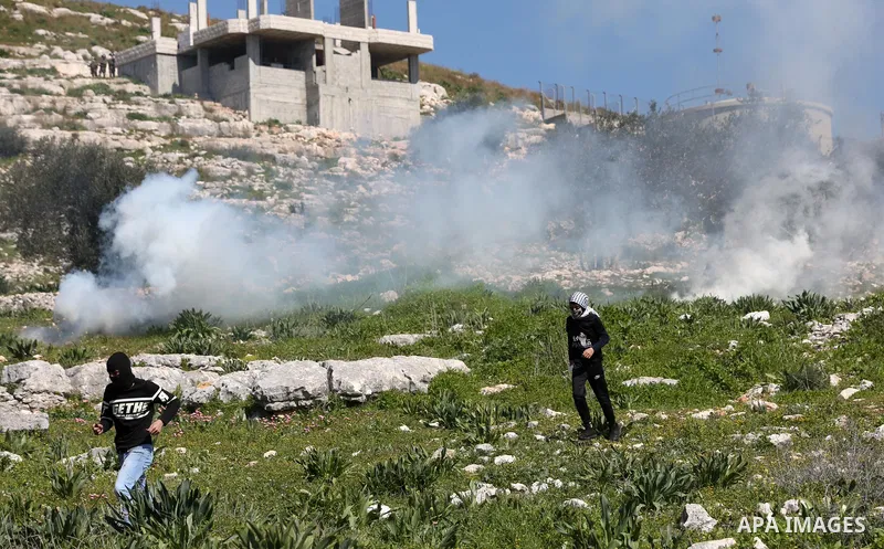 Palestinian protesters clash with Israeli security forces following a weekly demonstration against the expropriation of Palestinian land by Israel in the village of Kfar Qaddum, near the West Bank city of Nablus on Febru...