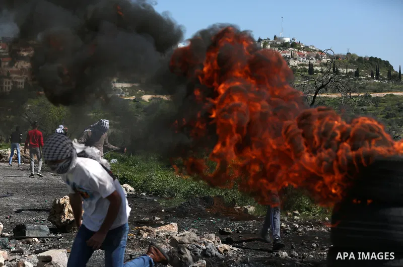 Palestinian protesters clash with Israeli security forces following a weekly demonstration against the expropriation of Palestinian land by Israel in the village of Kfar Qaddum, near the West Bank city of Nablus on Febru...