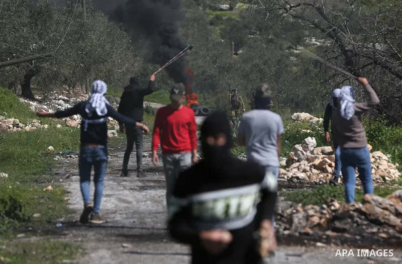 Palestinian protesters clash with Israeli security forces following a weekly demonstration against the expropriation of Palestinian land by Israel in the village of Kfar Qaddum, near the West Bank city of Nablus on Febru...