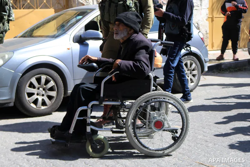 Palestinian protesters take part in a demonstration in memory of the 1994 Ibrahimi Mosque massacre, in which a Jewish extremist killed dozens of Palestinian worshippers, in the occupied West Bank city of Hebron on Februa...