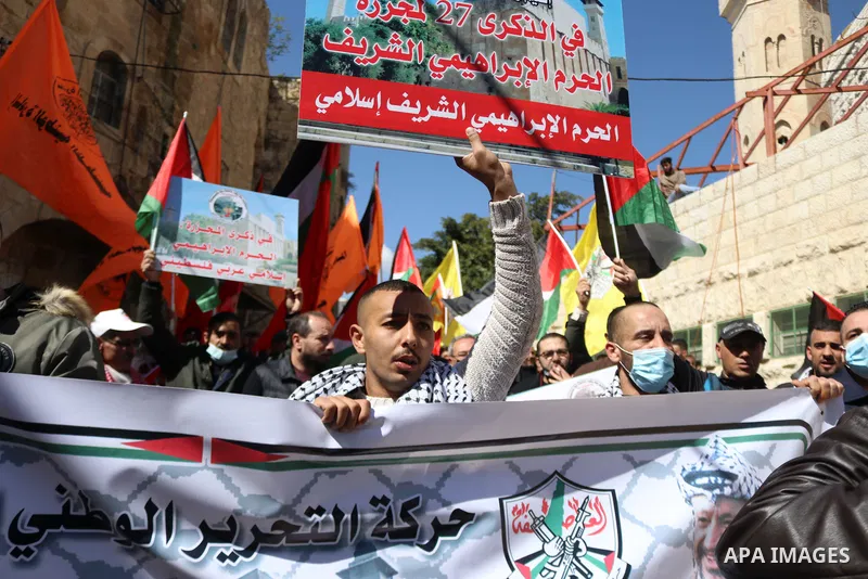 Palestinian protesters take part in a demonstration in memory of the 1994 Ibrahimi Mosque massacre, in which a Jewish extremist killed dozens of Palestinian worshippers, in the occupied West Bank city of Hebron on Februa...