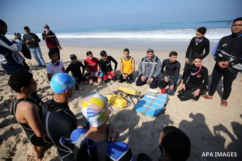 Palestinian divers take part in a volunteer campaign to search for the missing Egyptian sailors, in the sea of Gaza City on February 26, 2021. The Ministry of Interior in the Gaza Strip said that it found a body that was...