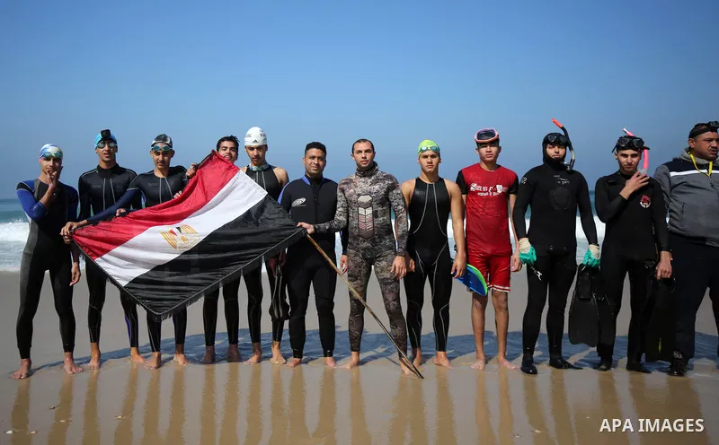 Palestinian divers take part in a volunteer campaign to search for the missing Egyptian sailors, in the sea of Gaza City on February 26, 2021. The Ministry of Interior in the Gaza Strip said that it found a body that was...
