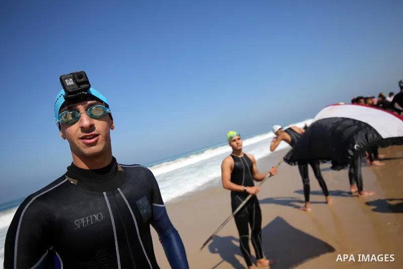 Palestinian divers take part in a volunteer campaign to search for the missing Egyptian sailors, in the sea of Gaza City on February 26, 2021. The Ministry of Interior in the Gaza Strip said that it found a body that was...