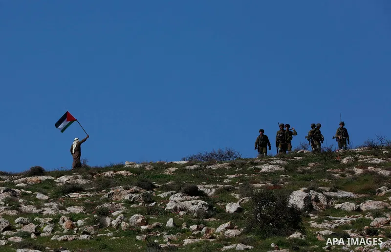 Israeli forces take position during a demonstration against the expansion of settlements, in Beit Dajan in the Israeli-occupied West Bank on February 26, 2021. The settler population in the West Bank has grown by around...