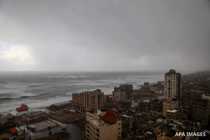 A general view shows the Gaza city during a stormy day, on February 17, 2021. The cloudy, stormy and very cold conditions are expected to continue on Thursday. Scattered torrential rain showers with thunderstorms and occ...
