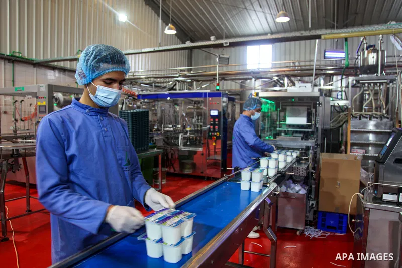 Palestinian employees work at Hanover factory for dairy, in Gaza city, on February 16, 2021. Hanover for food manufacturing, has been approved by LLOYD’S register to the following standards ISO22000:2018. Photo by mohamm...