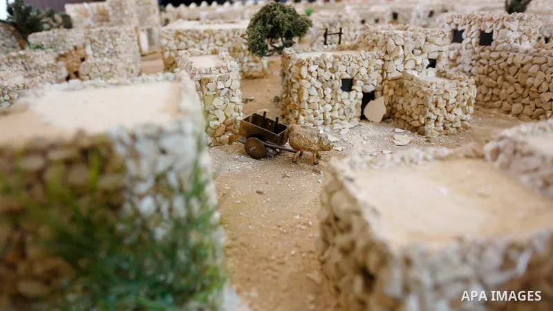 Palestinian engineer, Nora Jardaneh, works on rebuilding three models of Nablus in different periods of time, in the West Bank City of Nablus, on February 15, 2021. The sculptures embody the Roman time and the first city...
