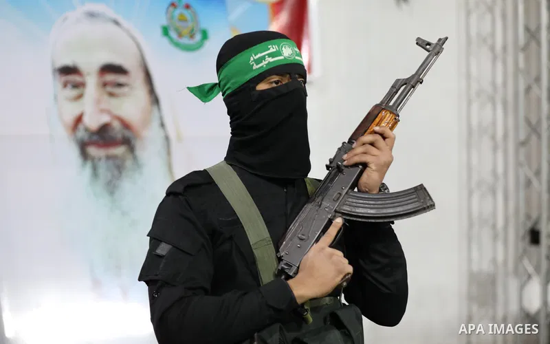 Members of Ezzedine al-Qassam Brigades, the armed wing of the Palestinian Hamas movement attend a memorial service for leader Ibrahim Al-Yazuri, who died of the coronavirus (COVID-19) pandemicin, Gaza City on February 14...