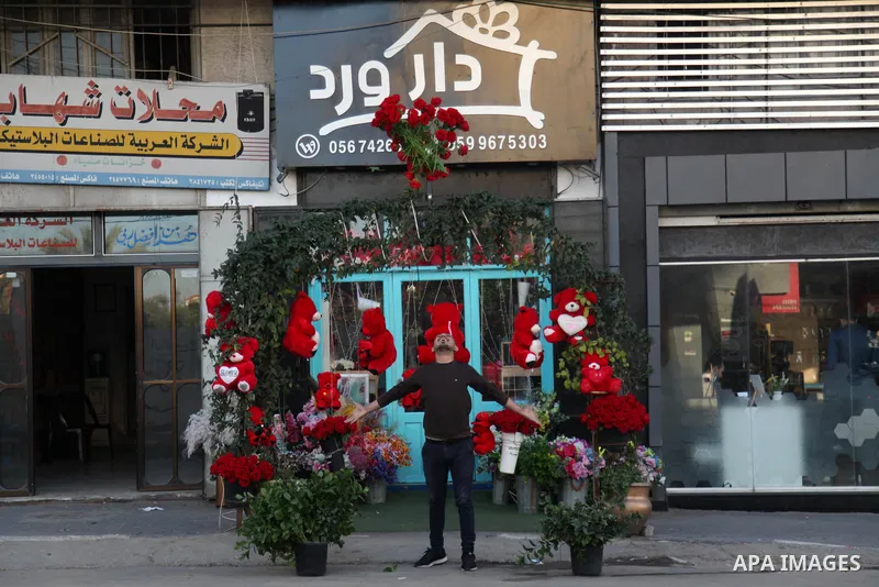 Palestinian vendors display flowers, red teddy bears, and pillows on Valentine's day, in Gaza city on February 13, 2021. Valentine's Day is increasingly popular in the region as people have taken up the custom of giving...