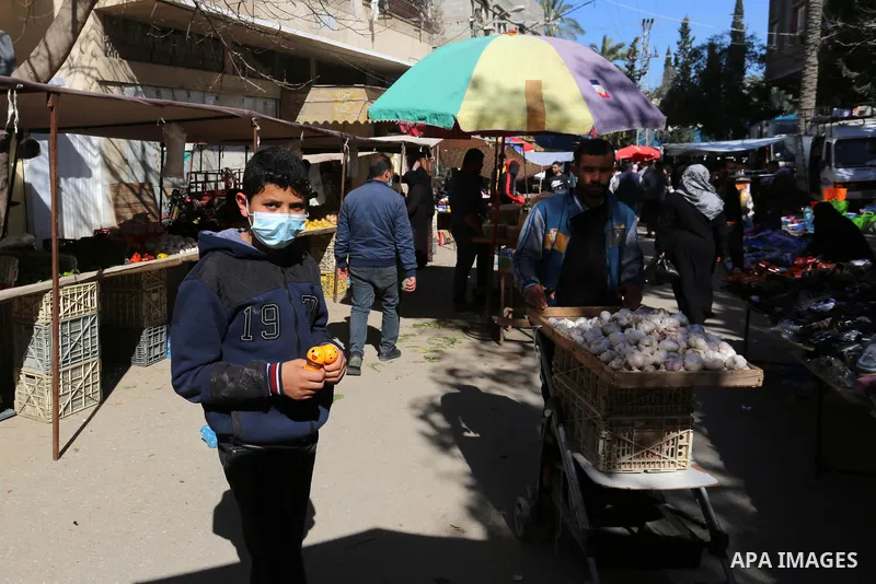 Palestinians shop at a popular market after lifting the state of closure, in Deir El-Balah, in the center of the Gaza Strip, on February 09, 2021. The Undersecretary of the Ministry of Local Government stated, "The decis...