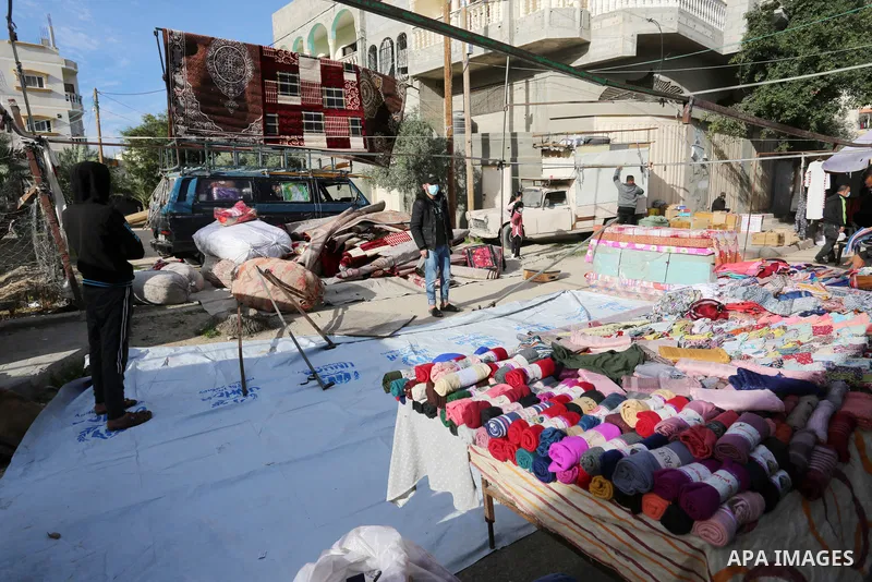 Palestinians shop at a popular market after lifting the state of closure, in Deir El-Balah, in the center of the Gaza Strip, on February 09, 2021. The Undersecretary of the Ministry of Local Government stated, "The decis...