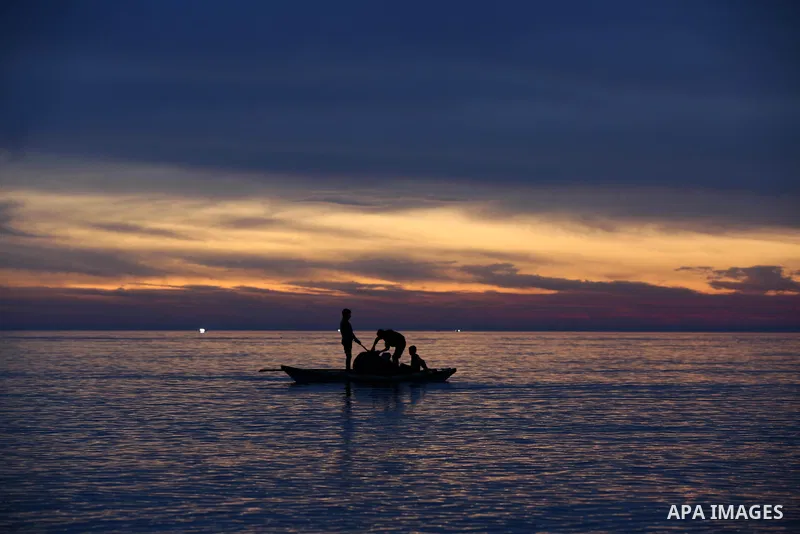Palestinian fishermen ride their boat in Mediterranean Sea, amid the outbreak of the coronavirus disease (COVID-19), in Deir Al-Balah in the center of the Gaza Strip on February 8, 2021. In 2018 and early 2019, the Pales...