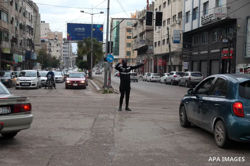 Palestinian police regulate traffic on the street in Gaza City on February 4, 2021. After the decision to ease the preventive measures taken by lifting the ban and daily night closings starting from today, Thursday, Febr...