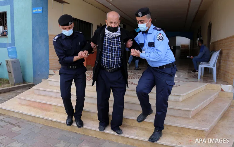 Palestinian citizens and drivers wait to file their complaints in front of the Traffic Police headquarters in Deir al-Balah, central of Gaza Strip on February 4, 2021. The General Administration of Traffic and Rescue Pol...
