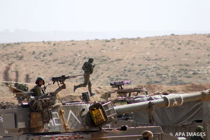 An Israeli army artillery unit takes part in a training session south of the Palestinian village of Yatta, in area C (where Israel retains control) on the outskirts of the town of Hebron, in the West Bank on January 2, 2...