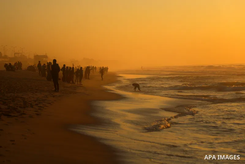 Palestinians enjoy their time on the beach, amid the outbreak of the coronavirus disease (COVID-19), in Gaza city on, on January 30, 2021. The Ministry of Interior announced a series of measures to alleviate the restrict...