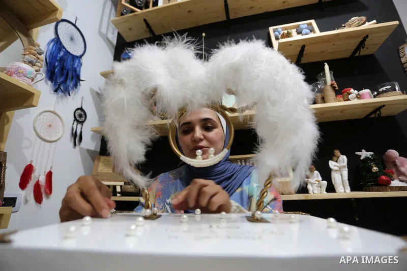 Two Palestinian graduates Haya Abu Daqqa and Areej Al-Saqa work in a gift and antiques store, in Khan Yunis in the southern Gaza Strip on January 28, 2021. Unemployment rate in the Gaza Strip is still among the highest i...