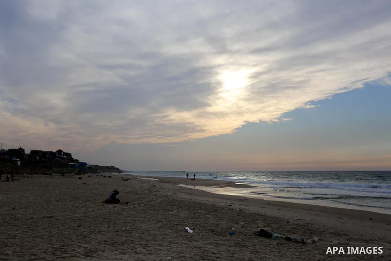 Palestinians enjoy their time on the beach, amid the outbreak of the coronavirus disease (COVID-19), in Deir Al-Balah in the center of the Gaza Strip on January 27, 2021. Photo by Ashraf Amra