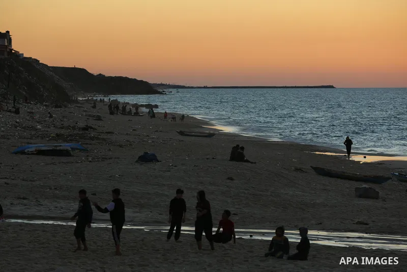 Palestinians enjoy their time on the beach after the coronavirus disease (COVID-19) restrictions eased, in Deir Al-Balah in the center of the Gaza Strip on January 23, 2021, the Ministry of Interior announced a series of...