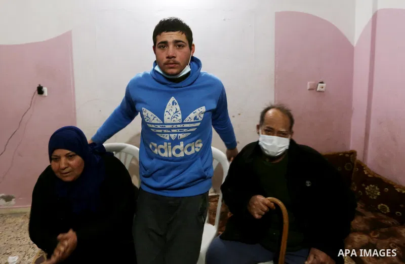 Freed Palestinian fisherman Yasser al-Zazoua, is welcomed by relatives upon his release from Egyptian authorities, at his home in Deir Al-Balah in the center of Gaza strip, on January 17, 2021. The Egyptian-Palestinian a...