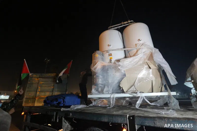Palestinians receive medical aid from the United Arab Emirate, in Rafah border crossing in the southern of Gaza Strip, on January 10, 2021. The second shipment of Emirati medical aid arrived in the Gaza Strip this evenin...