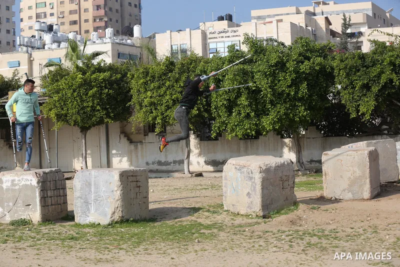 Palestinian youths who lost their legs, practice parkour in Gaza City on January 7, 2021. According to official statistics from the Palestinian Census Bureau, about 48,000 people in Gaza, or about 2.4 percent of the popu...