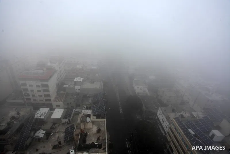 A general view shows the Gaza city during a heavy fog, in Gaza city, on January 3, 2021. Weather today in Palestine is sunny to partially cloudy and moderately cold in most districts with a rise in temperature, which app...