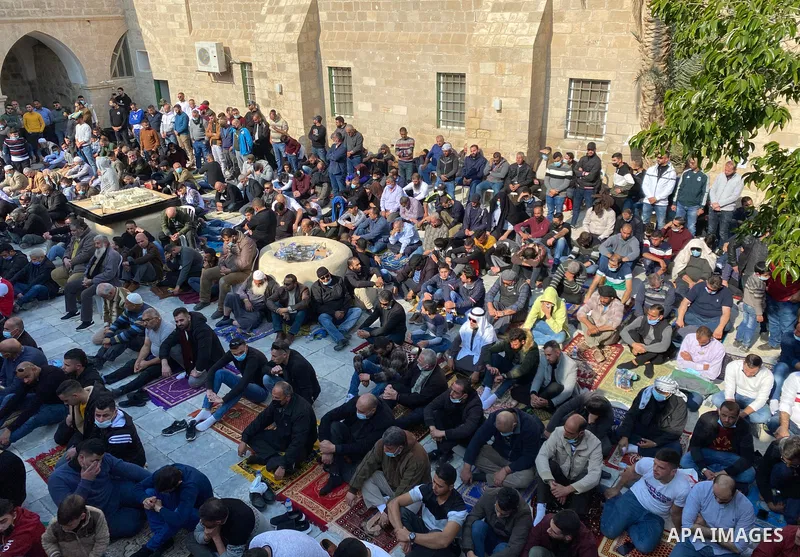 Palestinian Muslim worshippers perform the Friday prayer inside Maqam of Prophet Musa, in the occupied West Bank city of Jericho, on January 1, 2021. A rave DJ party which occured in Maqam of Prophet Musa in Jericho on D...