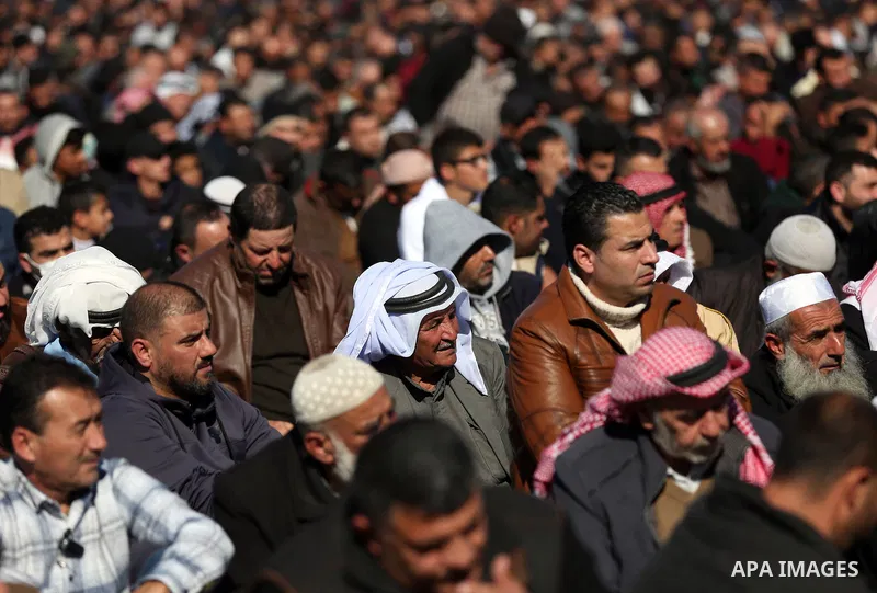 Palestinians attend the funeral of 8 workers who died a day earlier in a traffic accident while working in the Jordan Valley, on January 7, 2022, in the village of Aqraba, east of the West Bank city of Nablus. The worker...