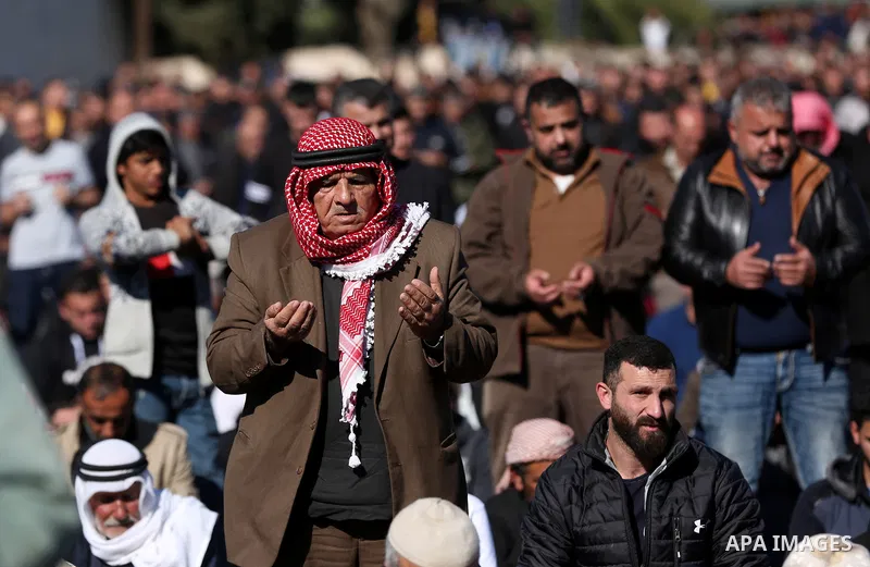 Palestinians attend the funeral of 8 workers who died a day earlier in a traffic accident while working in the Jordan Valley, on January 7, 2022, in the village of Aqraba, east of the West Bank city of Nablus. The worker...
