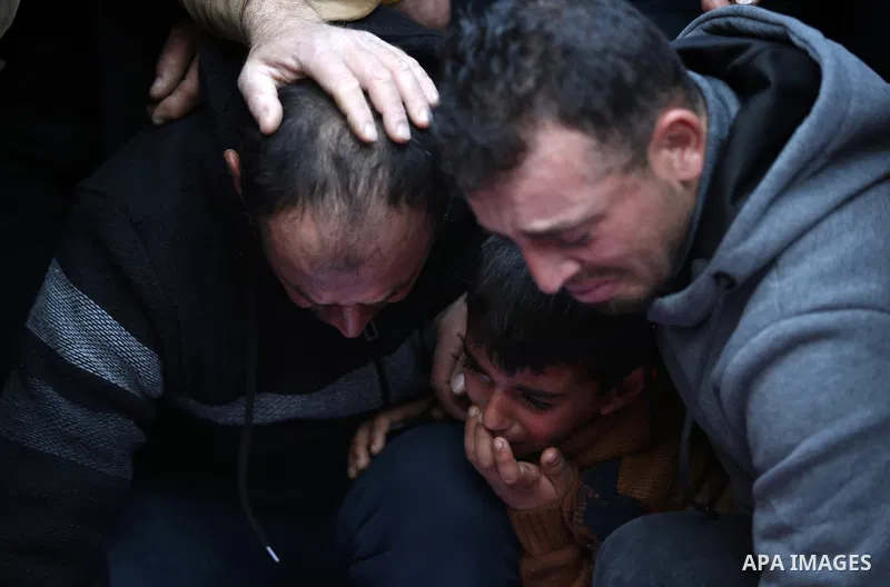 Palestinians attend the funeral of 8 workers who died a day earlier in a traffic accident while working in the Jordan Valley, on January 7, 2022, in the village of Aqraba, east of the West Bank city of Nablus. The worker...