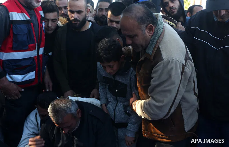 Palestinians attend the funeral of 8 workers who died a day earlier in a traffic accident while working in the Jordan Valley, on January 7, 2022, in the village of Aqraba, east of the West Bank city of Nablus. The worker...